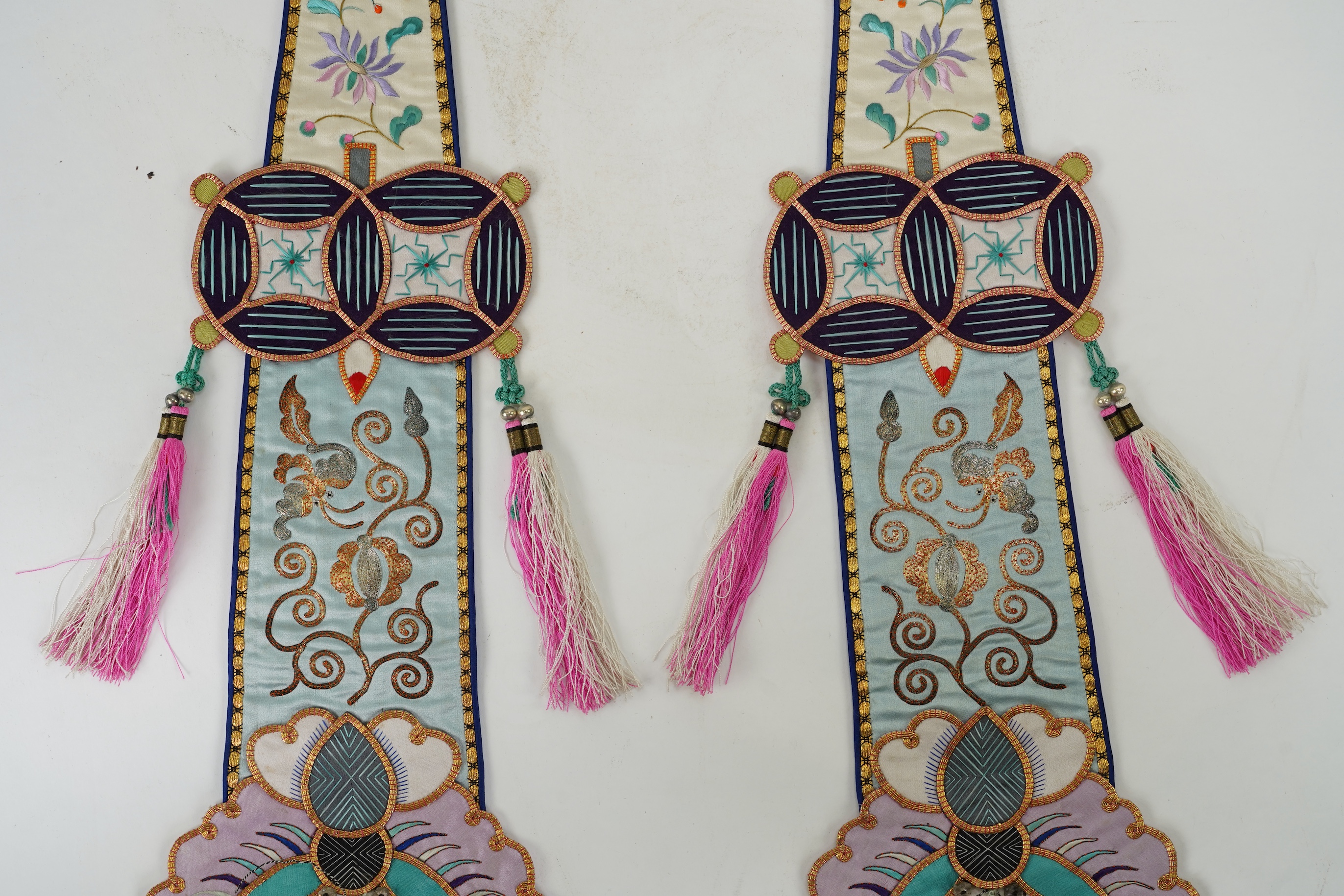 A pair of Chinese embroidered silk hanging pendants, early 20th century